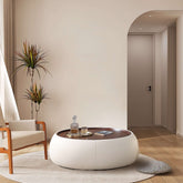 Modern round coffee table with storage, featuring a light luxury design